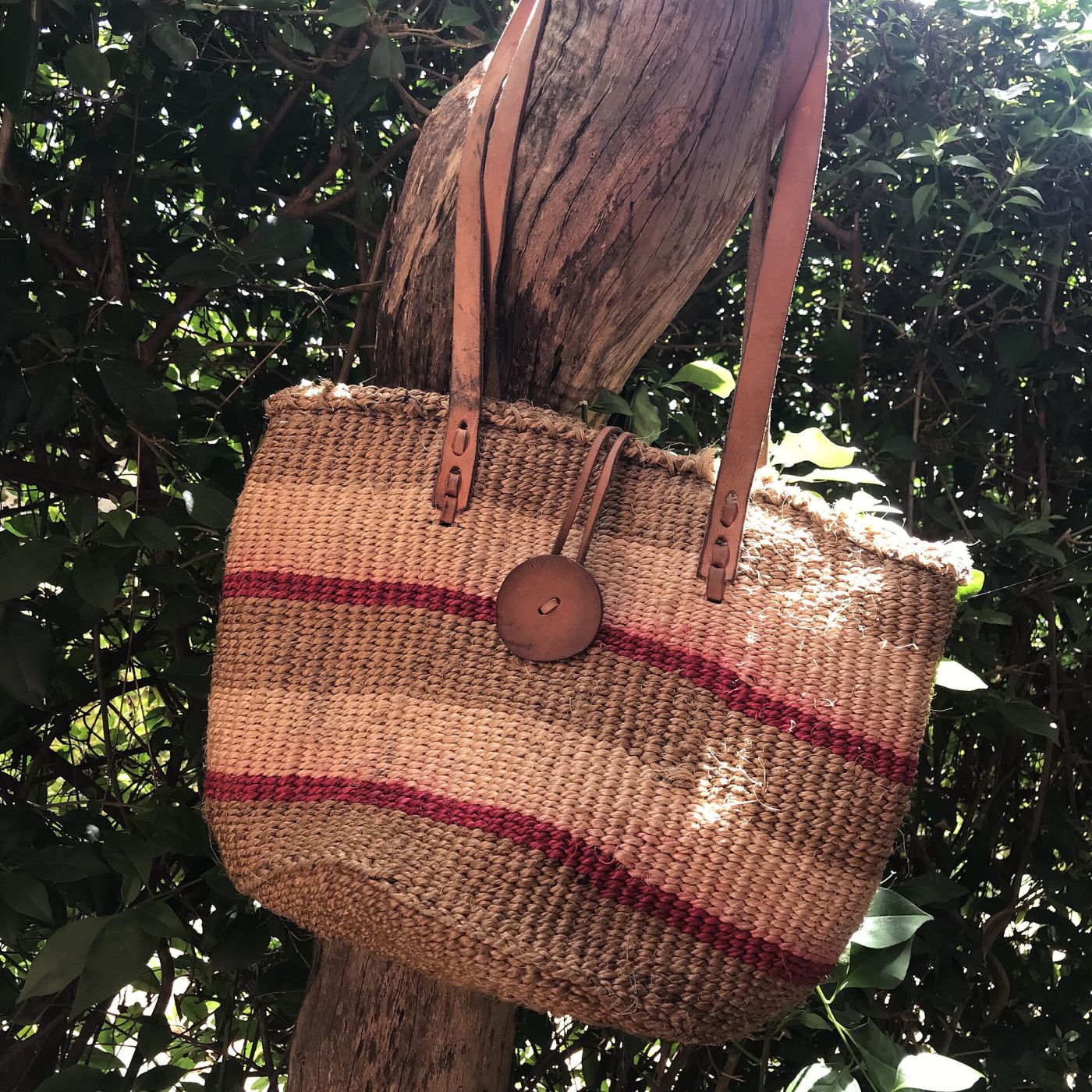 Sisal kiondo bag with striped weave and leather straps